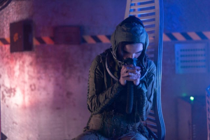 A woman communicating through a two way radio in a mining space