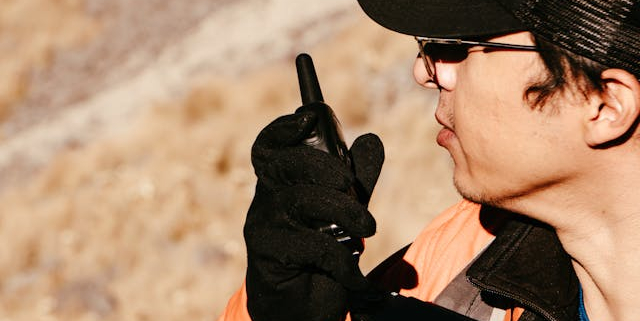 a man using a two-way radio for communication