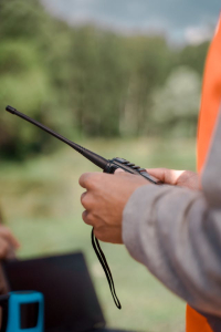 A man holding a two-way radio