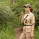 A woman using a two-way radio on her road-trip activity