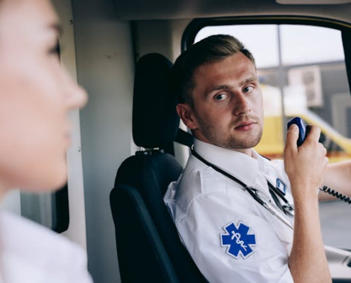 A man holding a black two-way radio