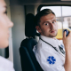 A man holding a black two-way radio