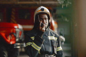 A fire-fighter communicating using a two-way radio